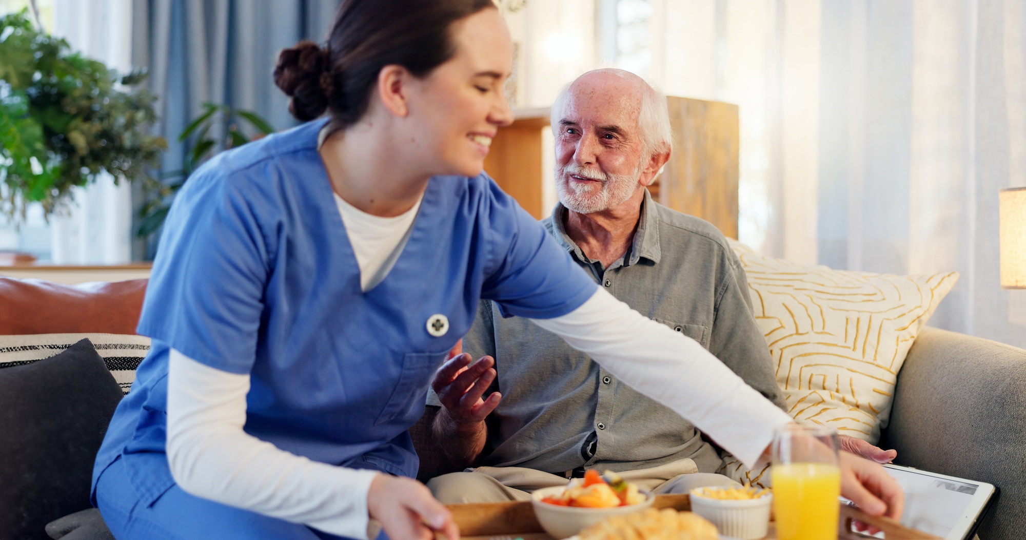 Breakfast, nurse and senior man in nursing home for elderly care, nutrition and support. Retired ma
