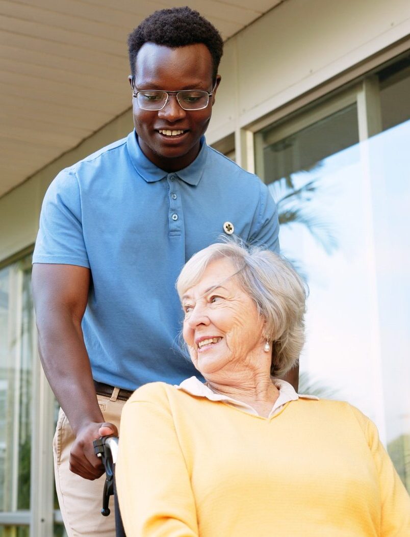 Senior woman, nurse and elderly care with wheelchair for walk, support or assisted living at retire